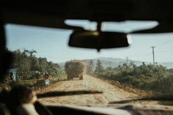 hitchhiking bucket list truck full of hay bales