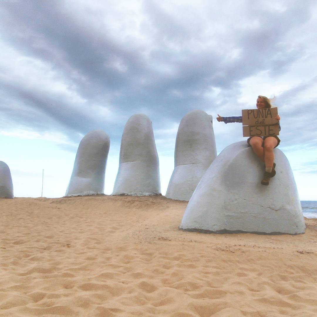 los dedos uruguay hand from the sand punta del este hitchhiking sign