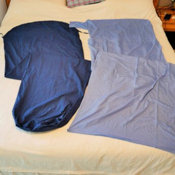 Sleeping bag liners on bed