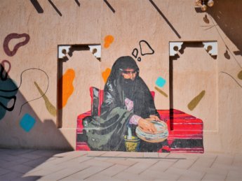 ajman heritage district street art woman