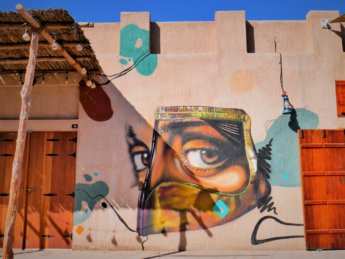 ajman heritage district street art woman eyes