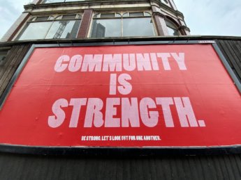 community is strength bullshit sign fake solidarity