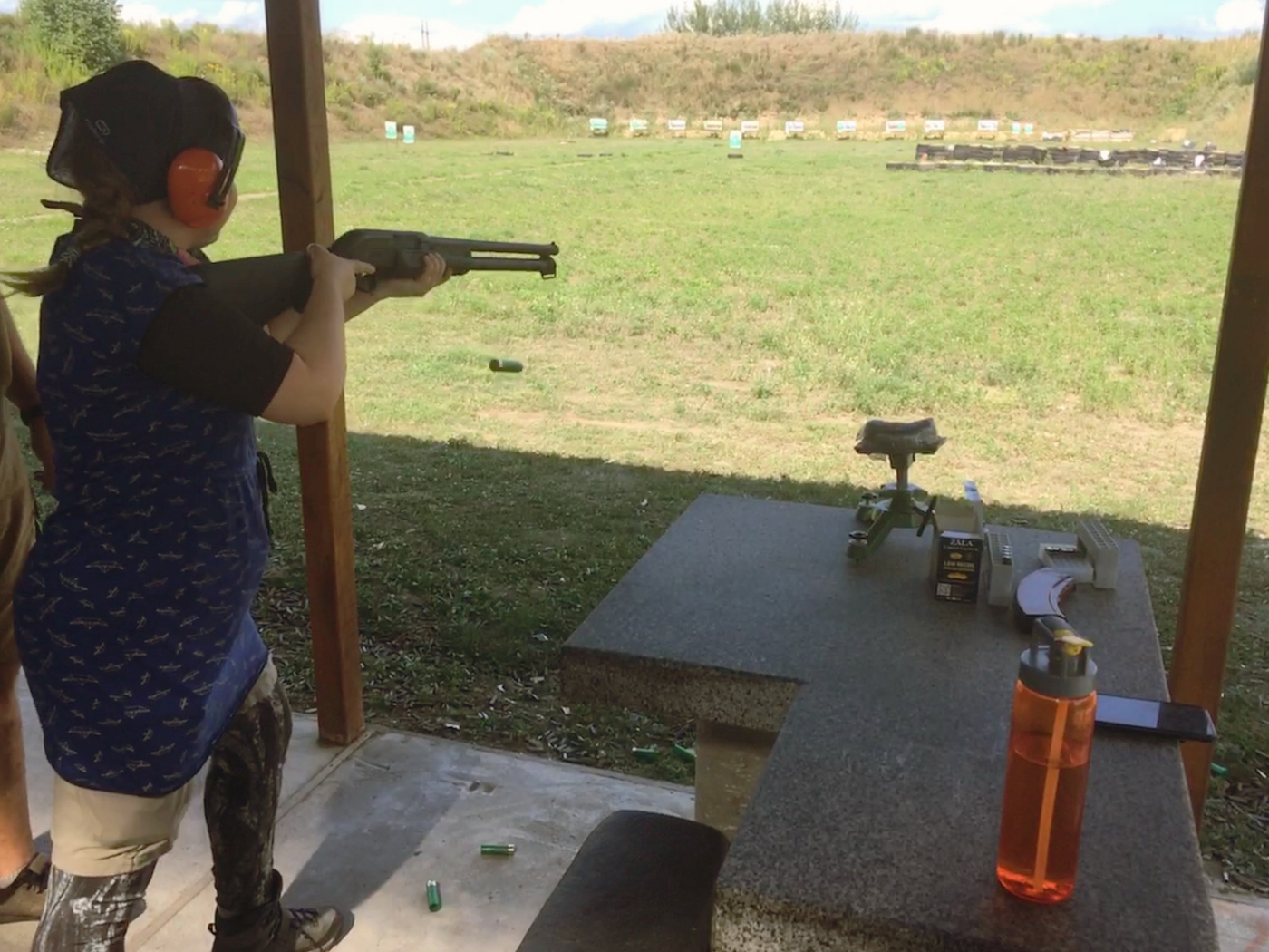 Iris shooting shotgun shell casings flying