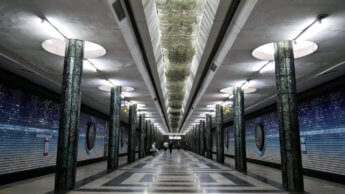 platform Kosmonavtlar station glittery shiny glass columns milky way ceiling lights gradient atmosphere earth space theme