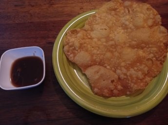 Street food in Mauritius fried papadom with tamarind sauce chutney