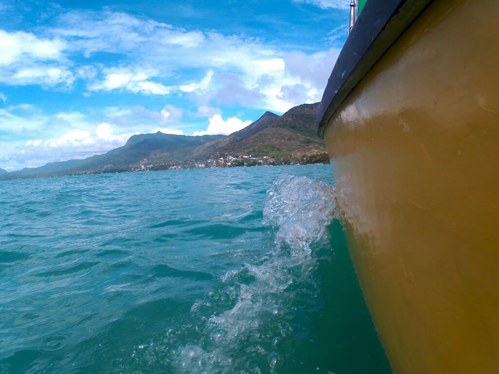 15 Pirogue sailing boat Mauritius dinghy lagoon La Gaulette racing through water regatta
