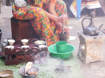 Stomping freshly roasted beans Ethiopian coffee ceremony Lalibela