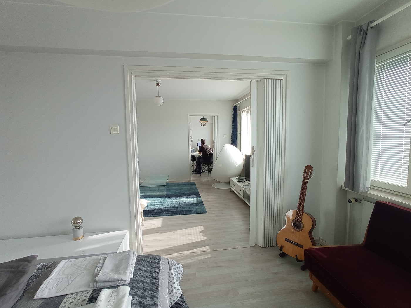 bedroom view of living room guitar Oulu Finland working digital nomad Airbnb