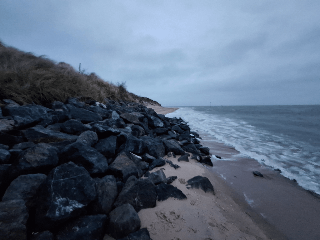 beach erosion protection breakwaters the Netherlands high tide climbing