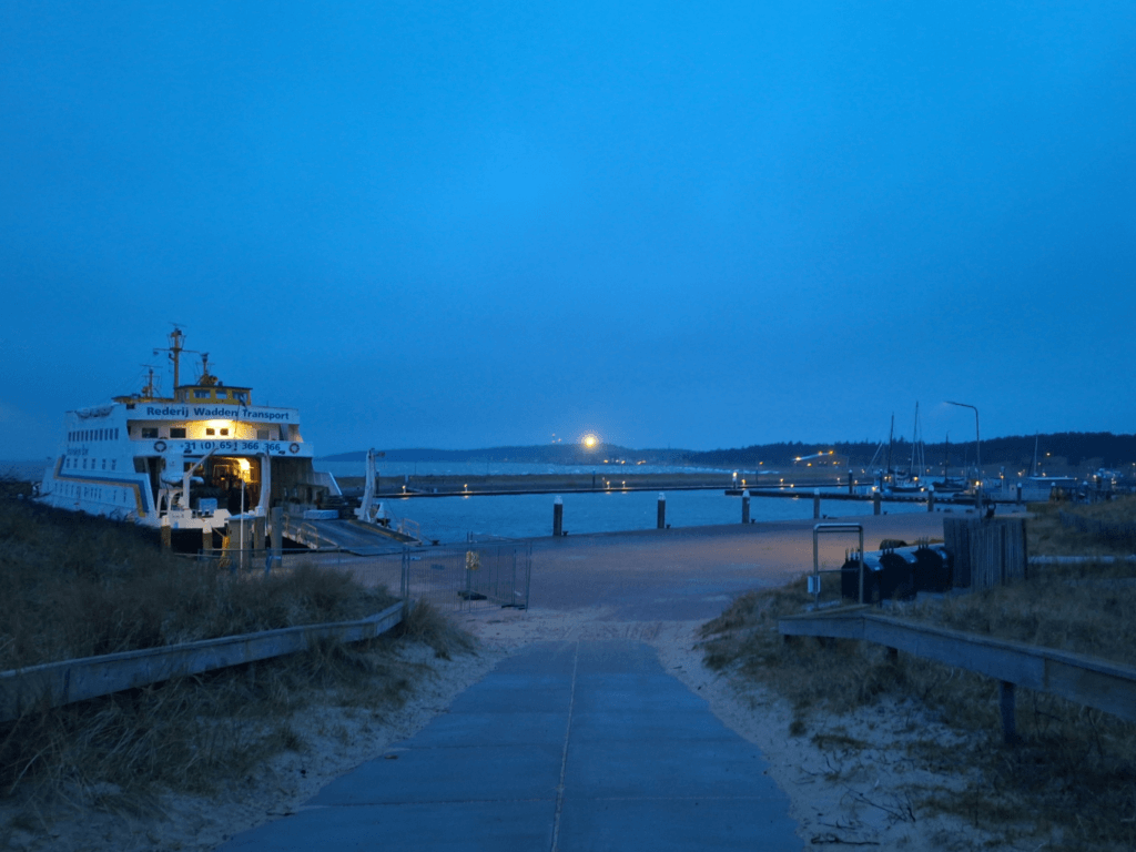 guest boat harbor Vlieland lighthouse at night the Netherlands small yachts