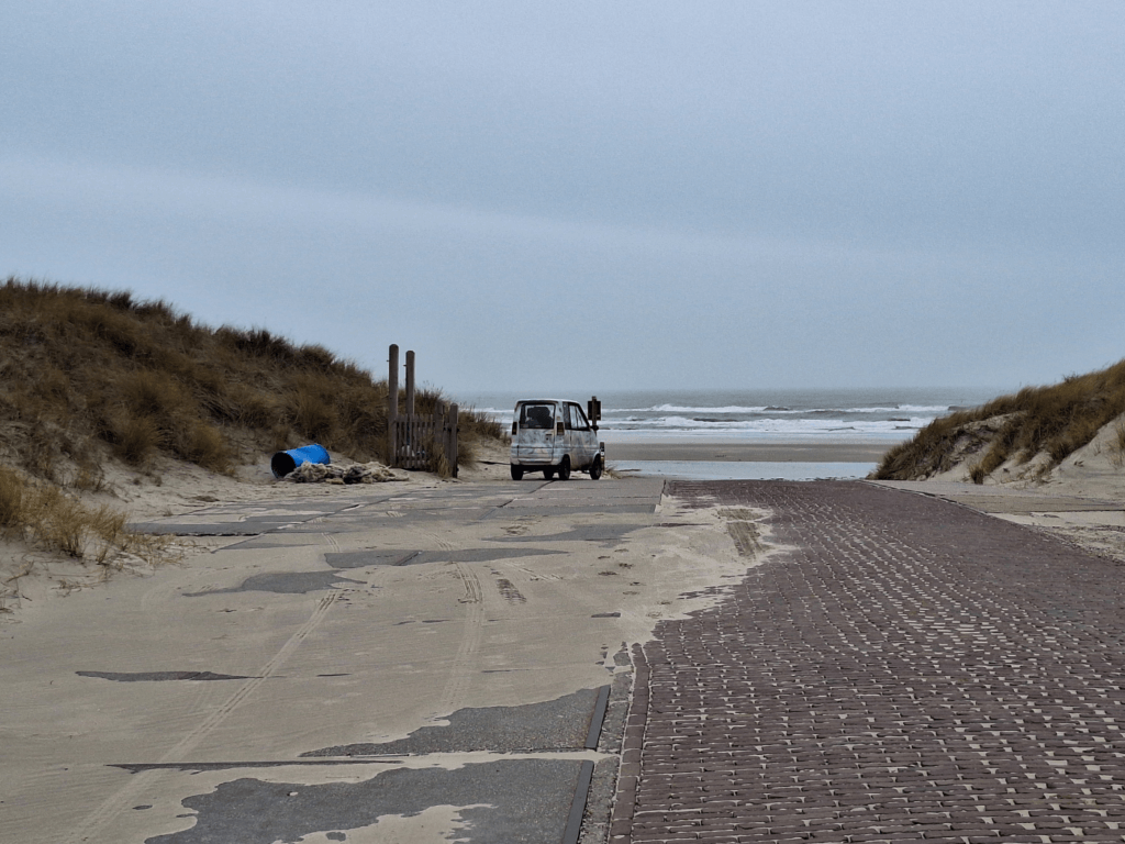 Dutch micro car canta on the beach birdwatching car free island Vlieland birdwatching