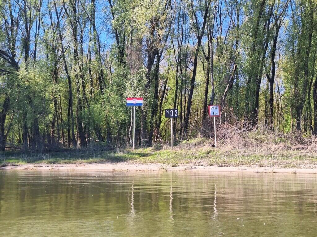 Triple border Hungary Croatia Serbia Croatian flag Danube river kayaking crossing