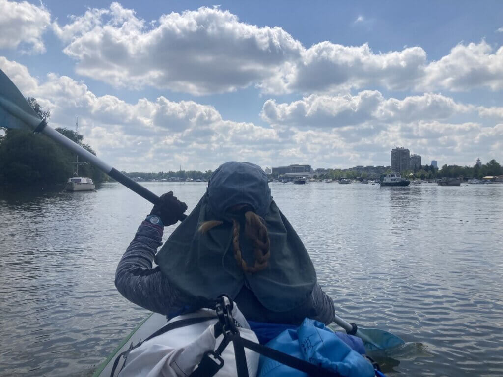 kayaking the Zemun New Belgrade arm of the Danube right around Veliko Ratno Ostrvo saling boat person man recreation fishing