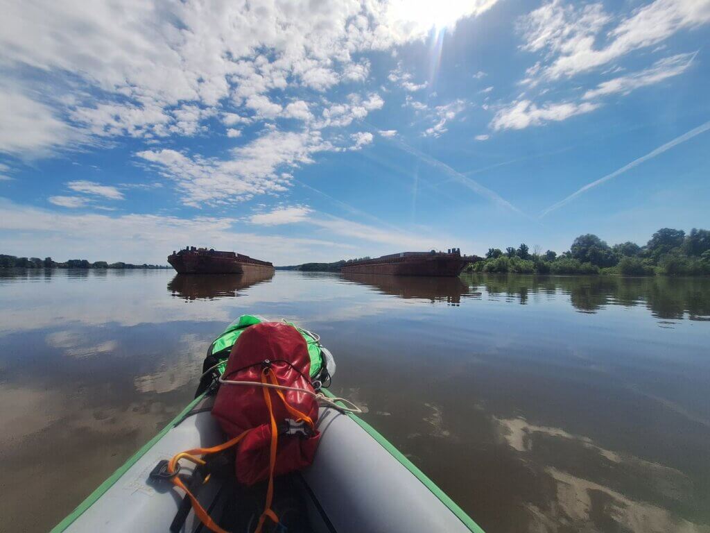 anchored barges Danube river paddling kayaking in between