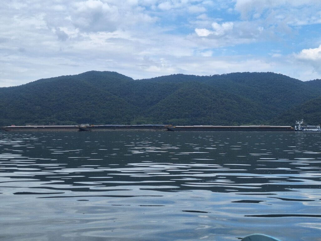 empty barge push boat danube three by two six traveling upstream Little Kazan Gorge Cazanele Mici Mali Kazan Klisura canyon Romania Serbia narrow inland shipping