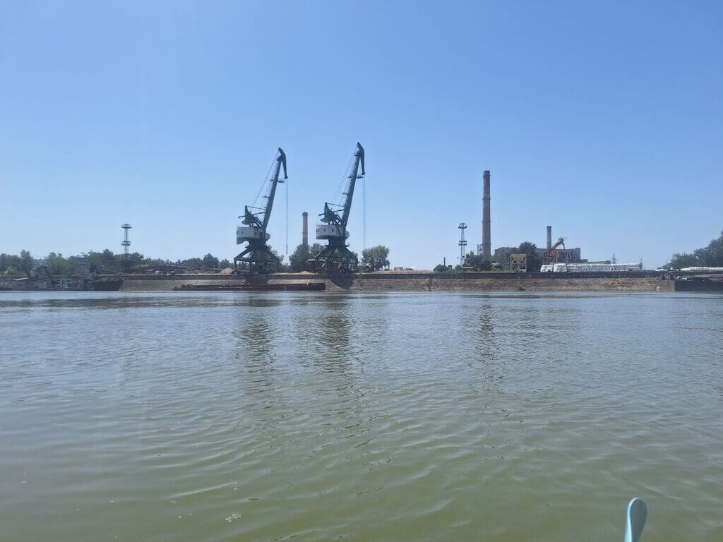 river port west of Svishtov Svilosa Sviloza cranes chimneys pulp factory Bulgaria kayaking
