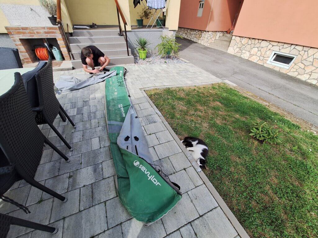 testing the fixed inflatable kayak puncture leak air compartment hole Pero the cat helps