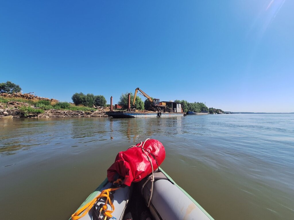 Chiciu ferry landing port of Calarasi Romania logging wood chopped forest barge deforestation Balkan