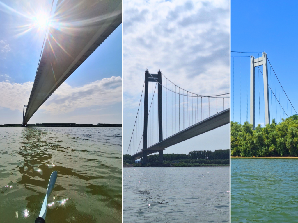 views of Braila bridge from a kayak Danube River Romania pillars golden gate of Europe