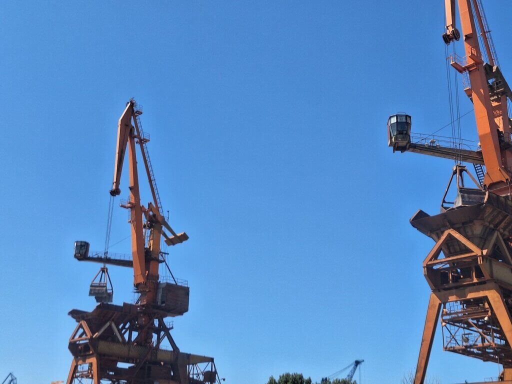 cranes of Tulcea port Danube River Romania cargo shipping grain travel Black Sea connection