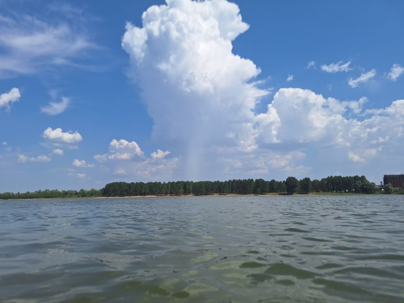 downpour over Balta Braila river island Balta Mica a Brailei Natural Park heavy rain summer heat clouds danger kayaking trip