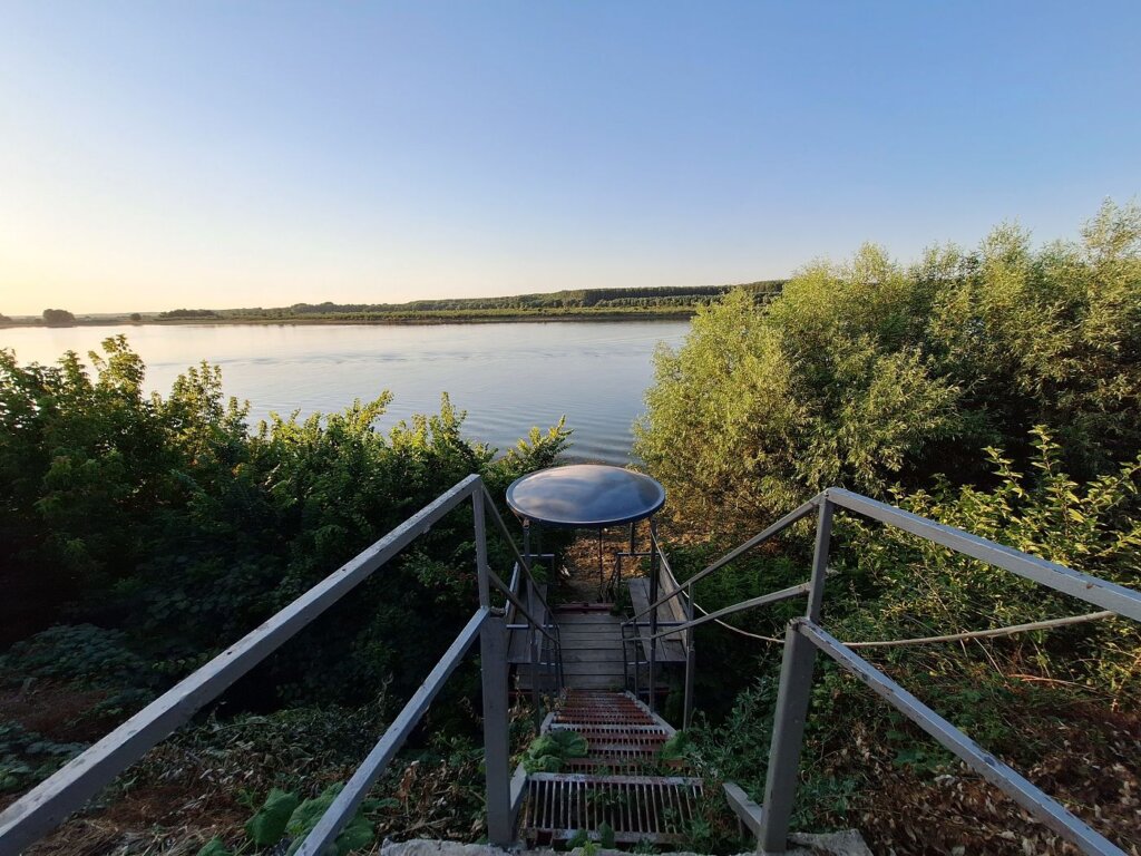 accommodation in Romania by the Danube River Casa Antonia Si Maria sunset stairs to the water jetty
