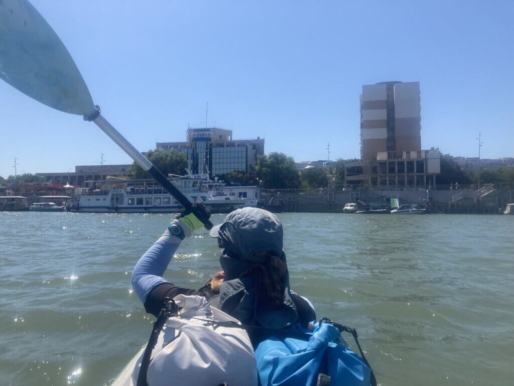 Iris Veldwijk kayaking Tulcea Danube River Romania city scape ferries on the river