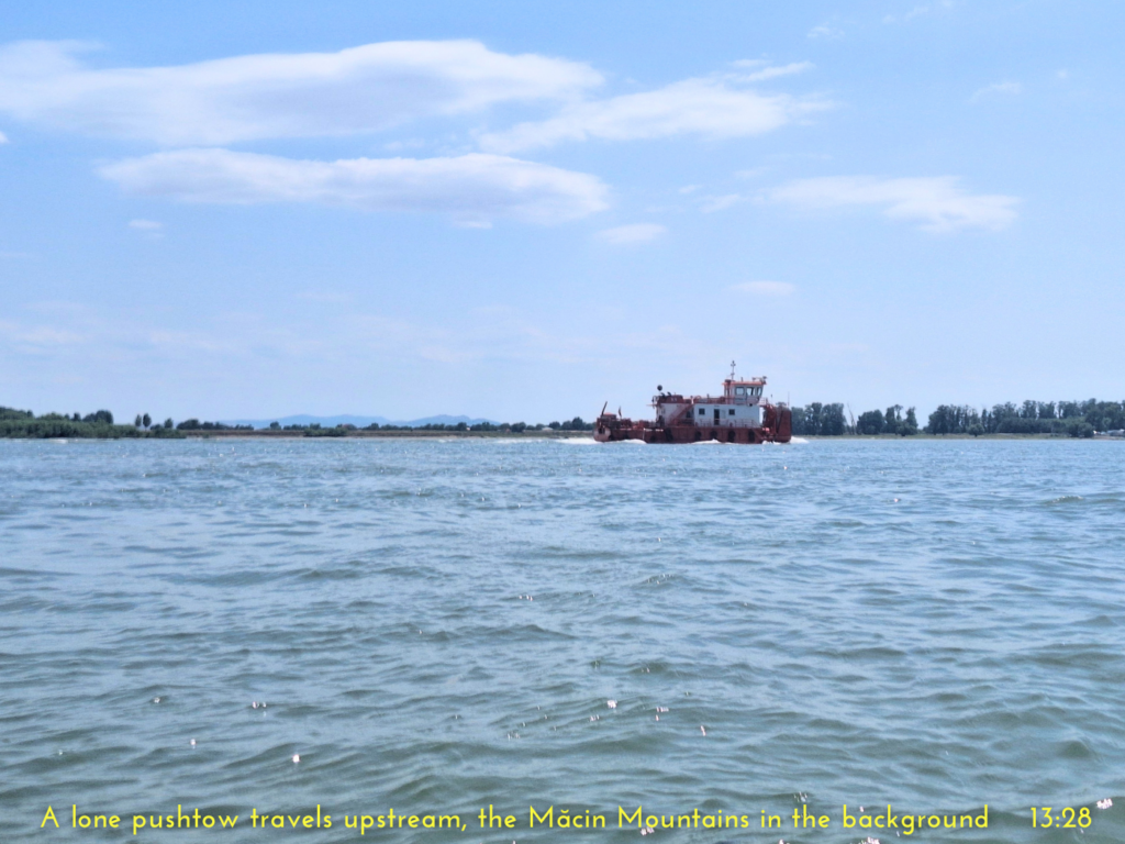 pusher boat pushtow barge on the Danube River Galati Macin Mountains in the background kayak trip day 82