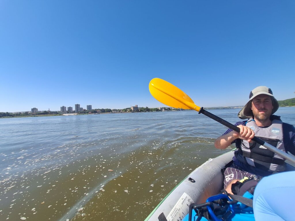 Jonas kayaking Danube River Silistra Bulgaria Chiciu Romania before Schengen border
