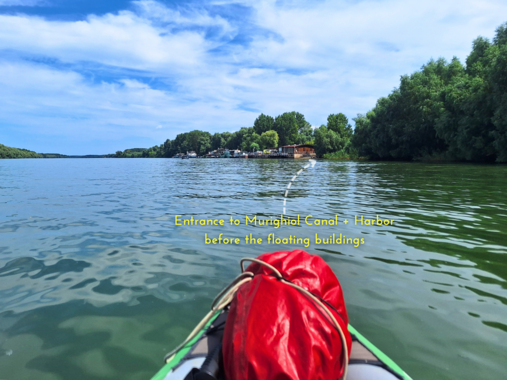 entrance to the Sfantu Gheorghe branch port of Murighiol on the Danube Delta narrow canal wayfinding kayak trip navigation