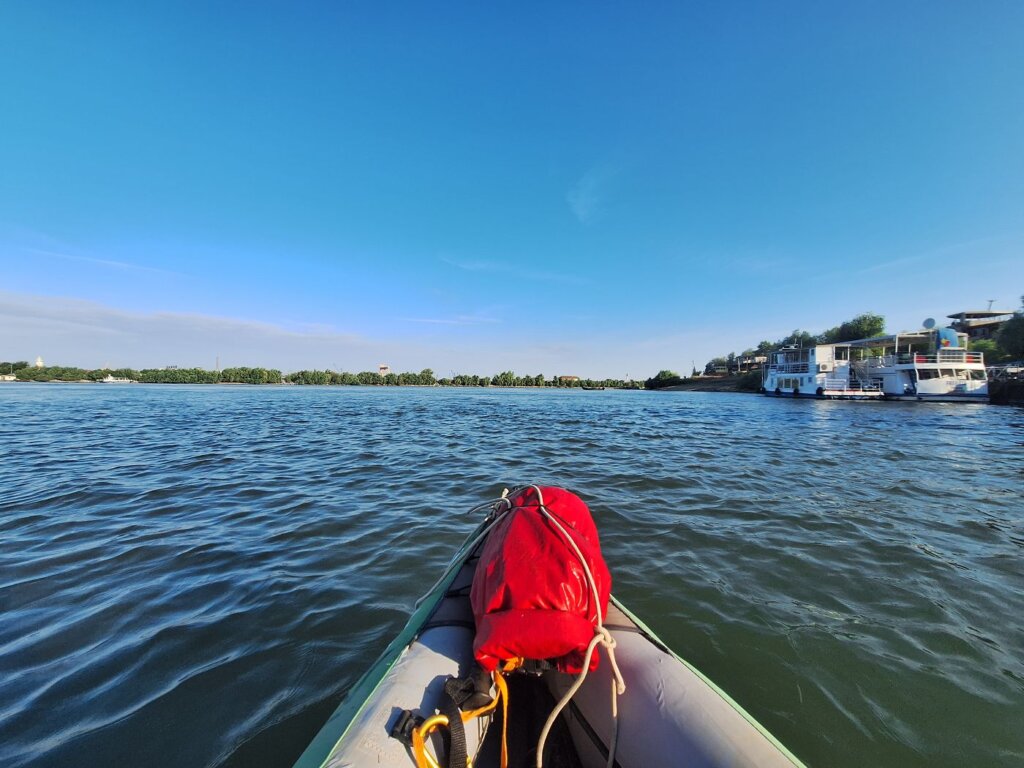 kayaking away from Tulcea Danube Delta Romania branch inflatable kayak
