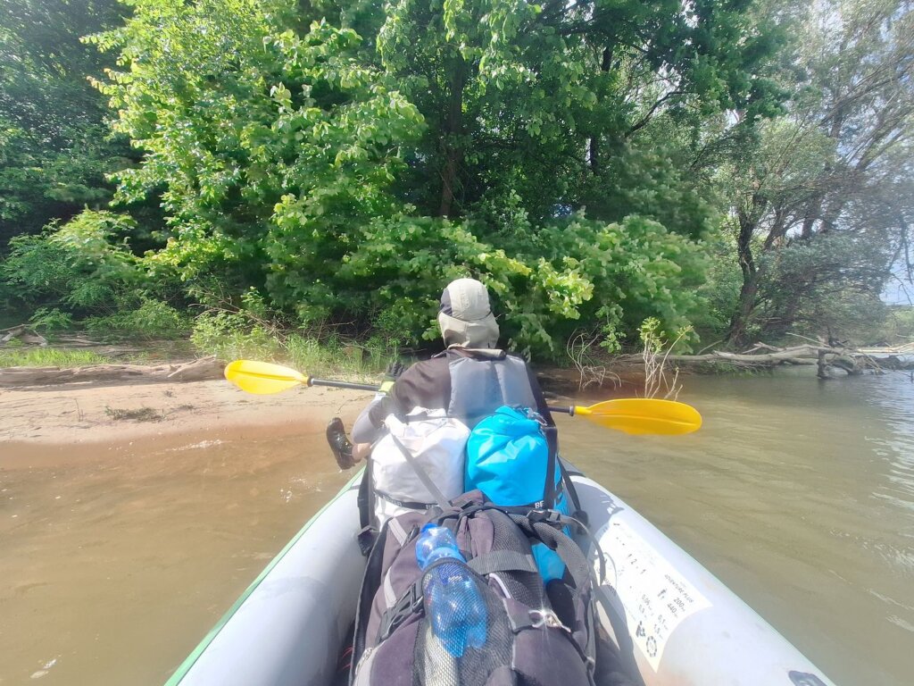 Jonas and Iris switching places in the kayak Zucchini front position back headwind trim of the boat paddle strength