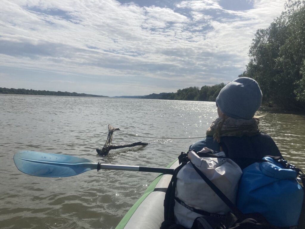 Iris Veldwijk kayaking Danube River to Smederevo headind pause at a stick in the water