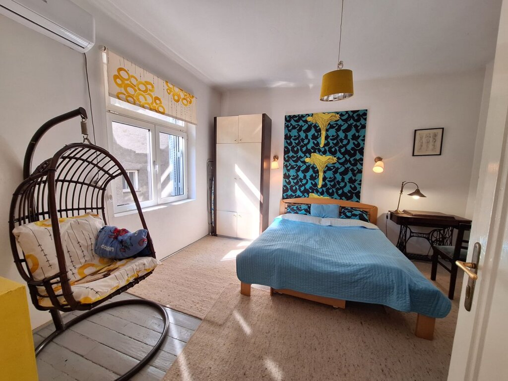 accommodation in Serbia amazing bright bedroom Belgrade reading nook chair