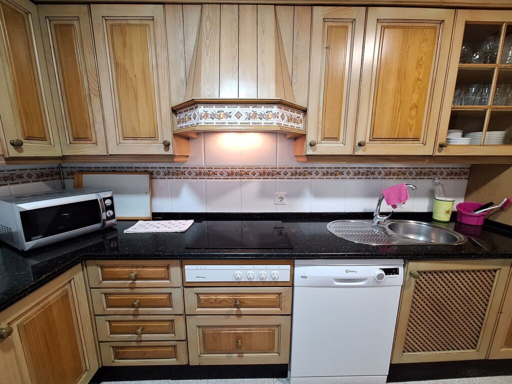 kitchen closeup stovetop wood older house rental Tarifa Spain Andalusia