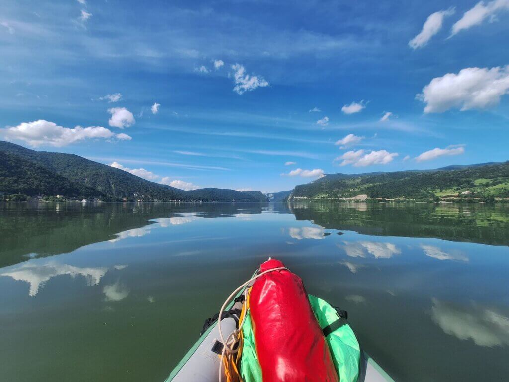 reflections on the Danube River Romania Serbia approach of Cazanele Veliki Kazan Klisura Gorge Great Kazan Gorge vista Miroc Strbac peak vista cliffs rock