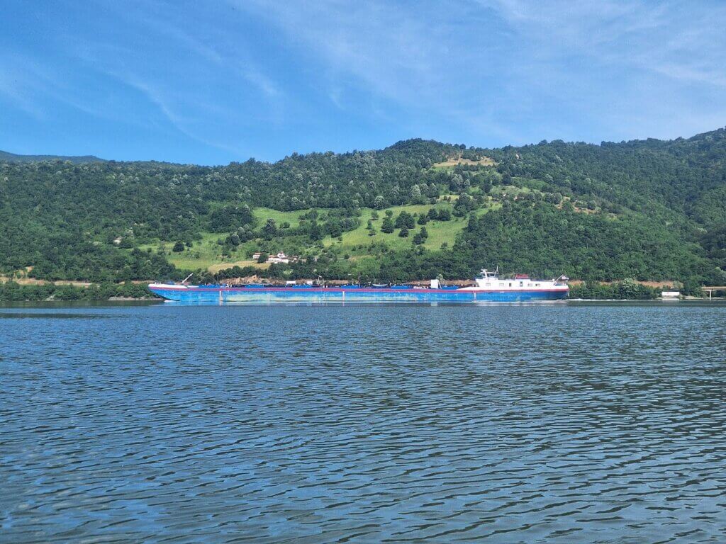 Danube River cargo ship inland boat shipping Iron Gate narrow Great Kazan Gorge canyon klisura Veliki Kazan Cazanele Mari