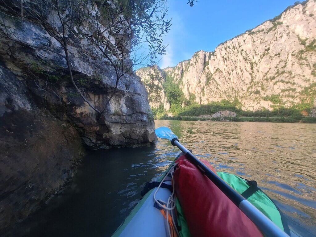 parallel to Romanian rock cliff Cazanele Mari Veliki Kazan Klisura Gorge Great Kazan Gorge kayaking inflatable border area Serbia