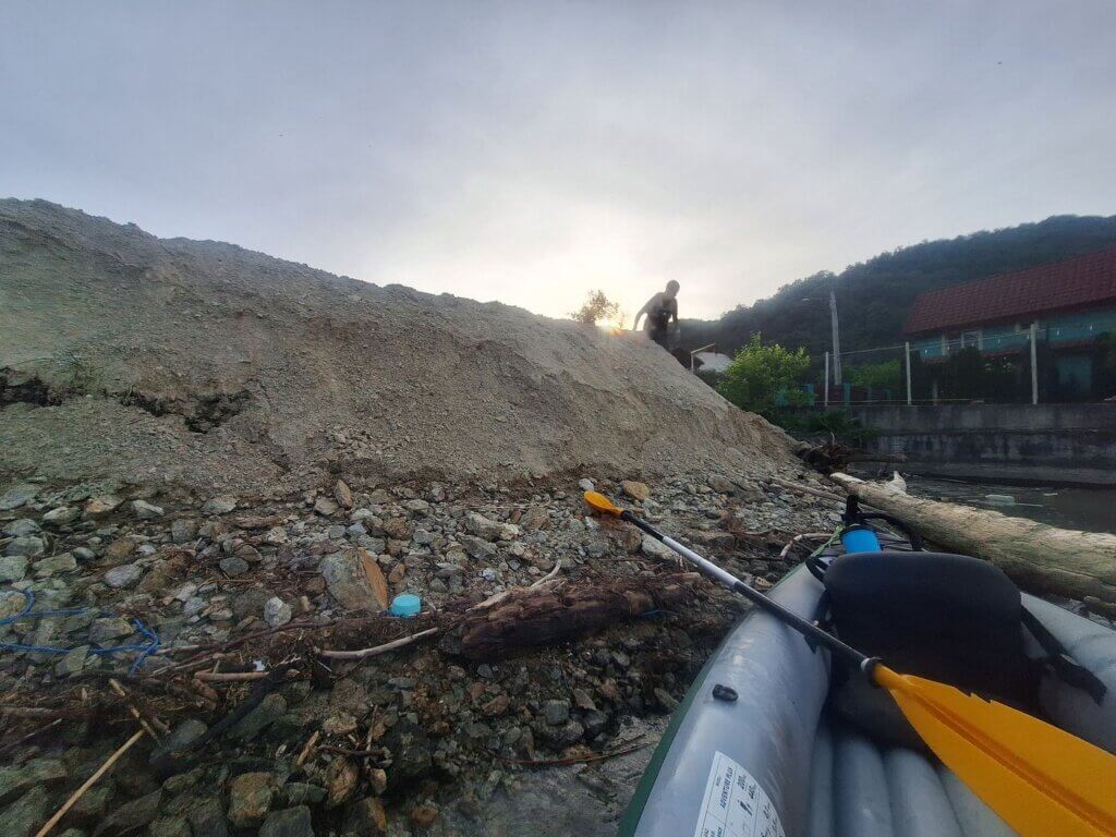 not ideal landing spot construction site Dubova Danube River inflatable kayak with a leak sunset Romania