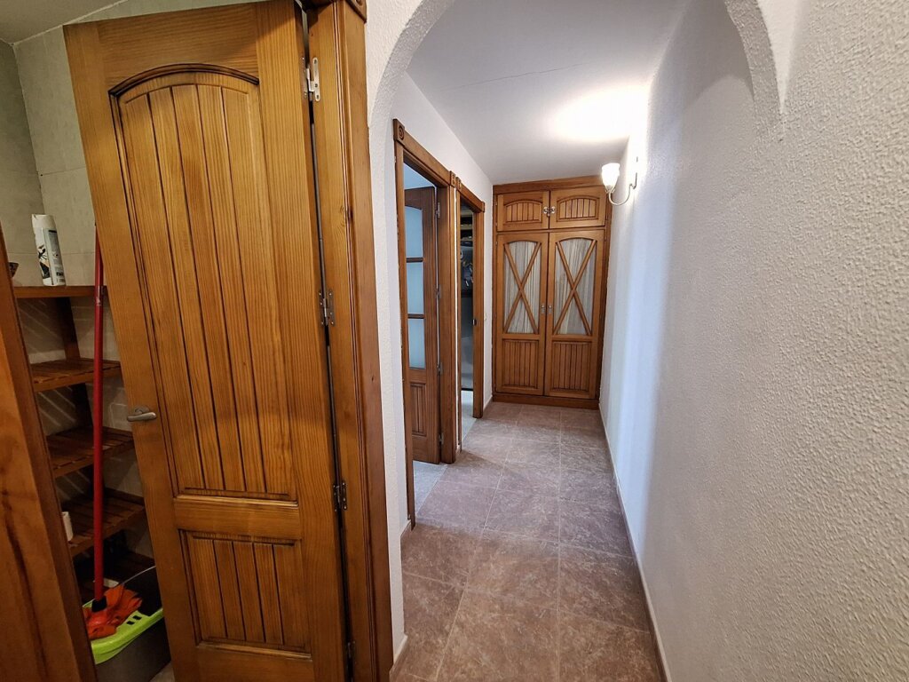 hallway to toilet, office room, and kitchen in rental house Tarifa Spain