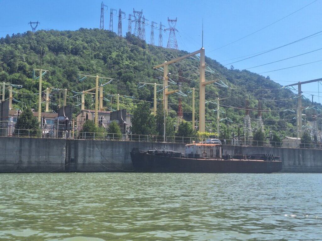 substation Iron Gate I dam lock Derdap I Portile de Fier I shipping canal Danube River Romania Serbia hydropower station rusty boat