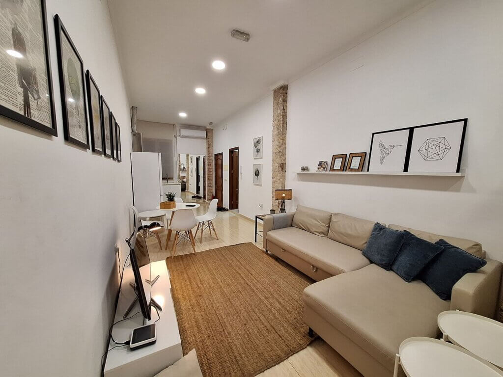 Airbnb Melilla accommodation in Spain living room couch dining table digital nomad travel Africa