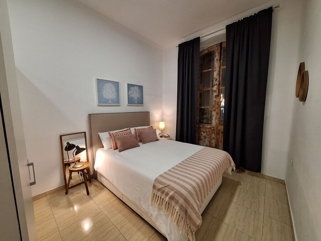 bedroom Melilla studio apartment accommodation in Spain window plaza