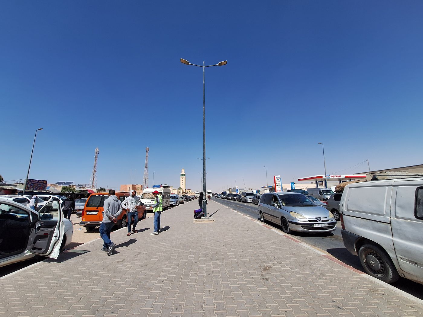 waiting for Guerguerat border to open after lunch Moroccan side traffic jam crowded pedestrian international travel Mauritania