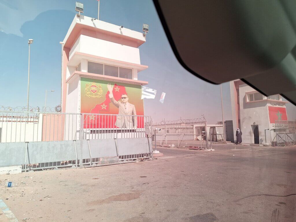 Moroccan border from Guerguerat No man's land king of Morocco flag berm wall