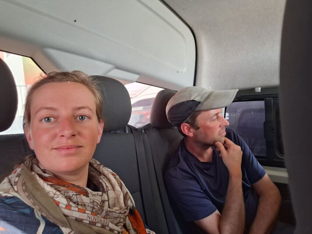 Iris Veldwijk and Jonas waiting in El Moussavir minivan departure immigration customs Morocco to Mauritania