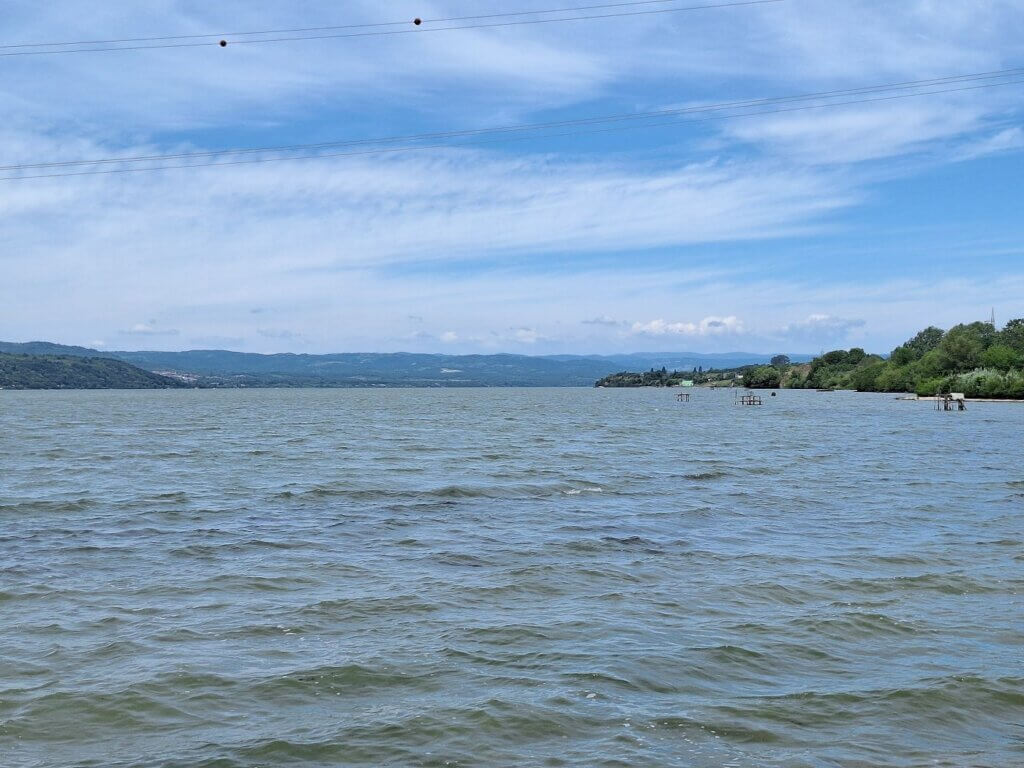 looking back at the Danube impounded water of Iron Gate II lake dam near Gogosu Tiganasi Crivina Comoara Istrului Romania