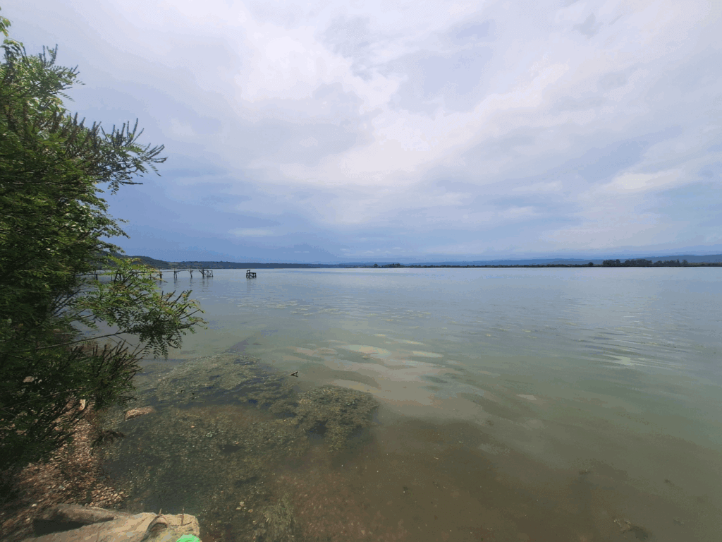 Danube River at Crivina Romania kayak cycling trip guesthouse welcome jetty incoming rain and thunder