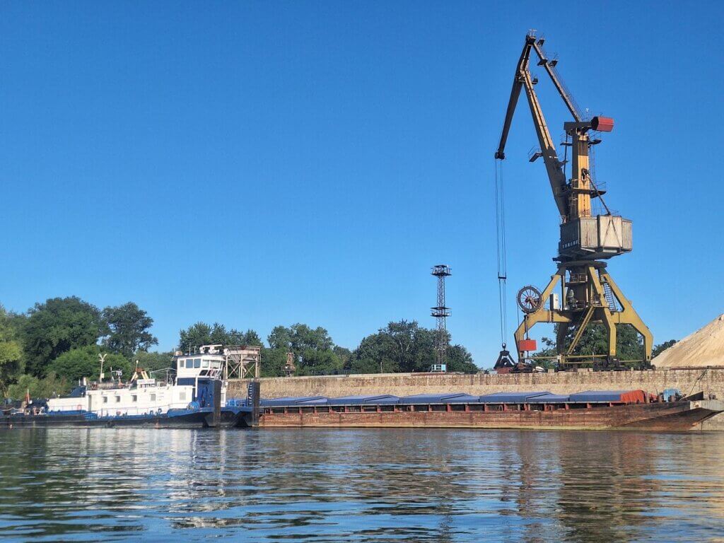 crane inland cargo ship Vidin Bulgaria southern industrial zone aggregates Danube River transport