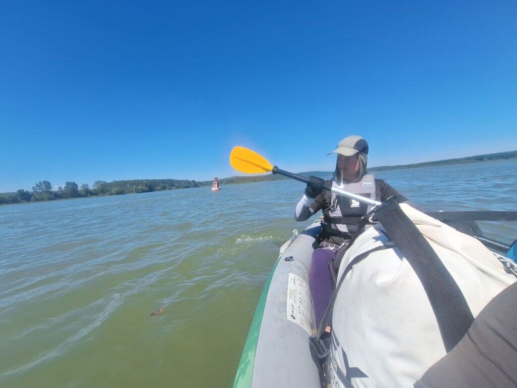 Jonas kayaking Archar river confluence Danube River Bulgaria paddling to Lom red buoy shipping lane
